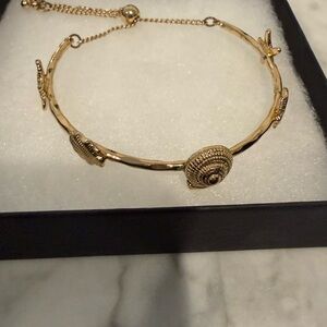 Gold starfish and shell slider bracelet